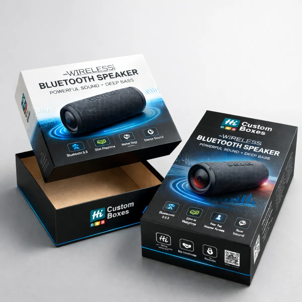 Two premium black and white speaker boxes displayed with a removable lid and high-quality graphics. class=